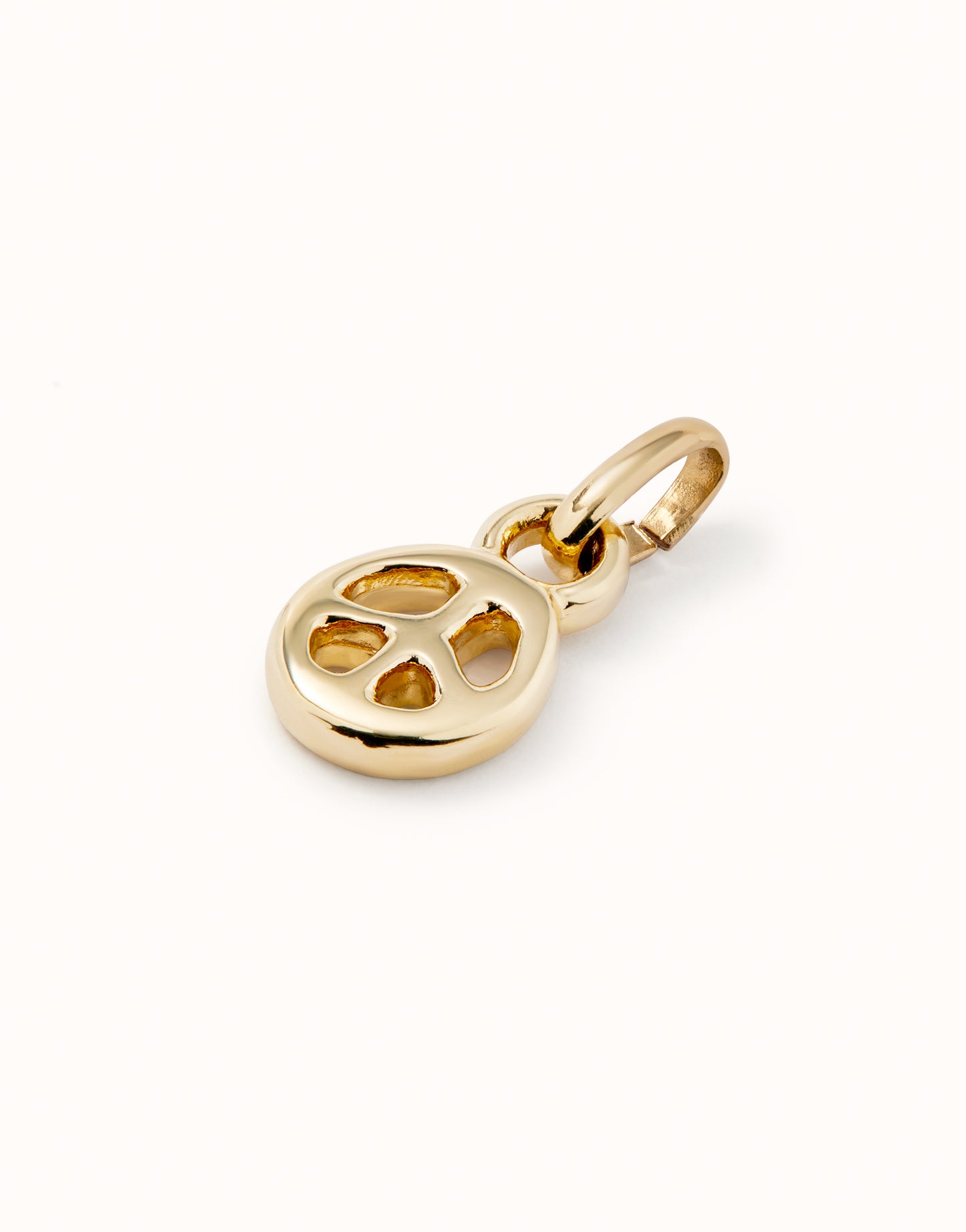 Uno de 50 18K gold-plated peace symbol charm.